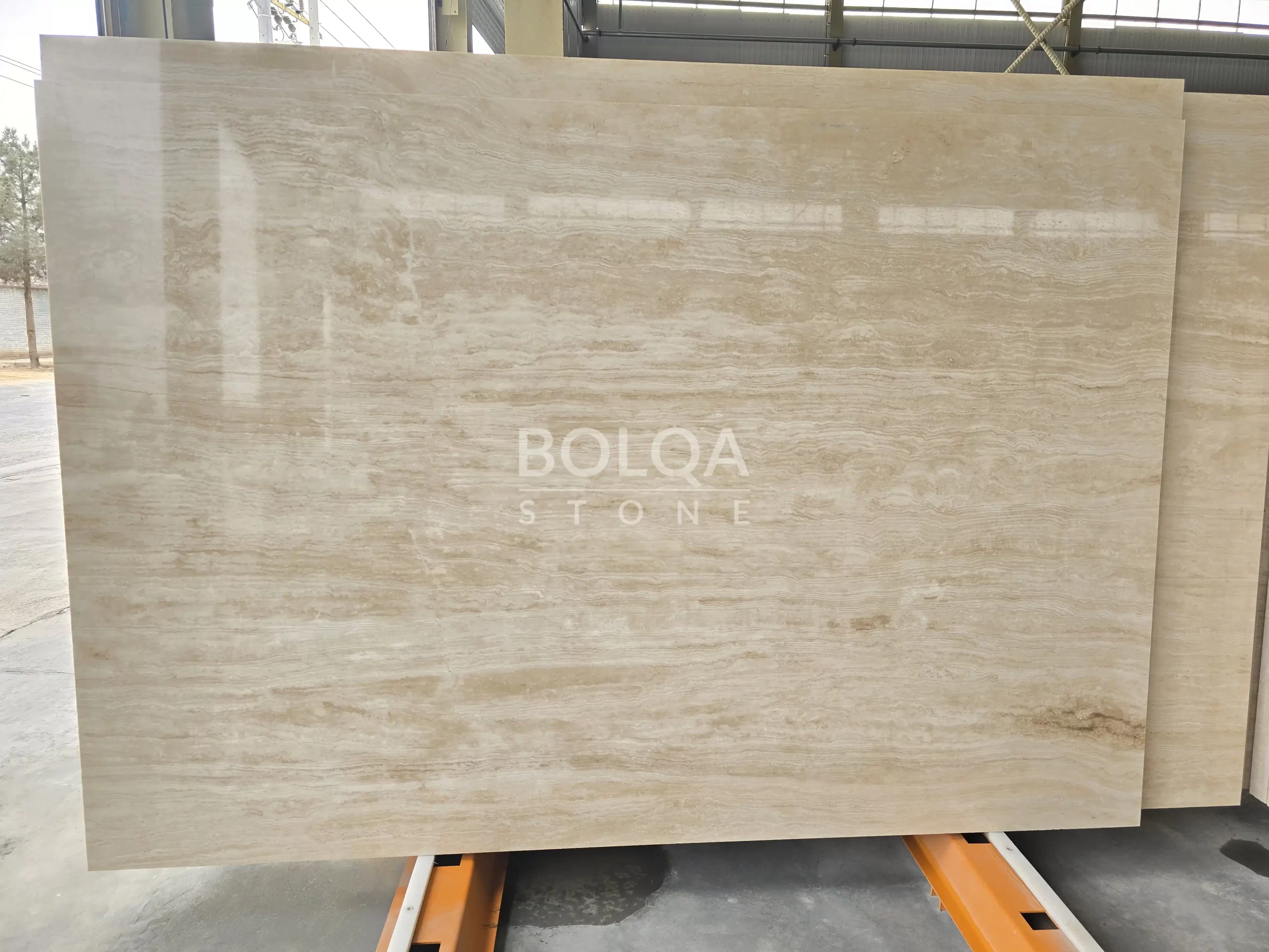 Ivory white travertine slab | BOLQA Stone Group